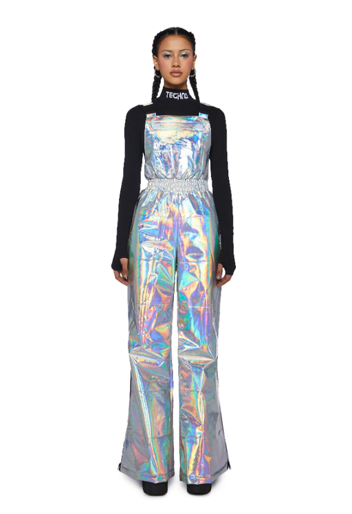 A woman wearing a shiny Dolls Kill dress with a black long-sleeve underneath
