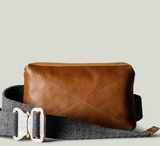 A close-up of a Hard Graft Leather crossover bag