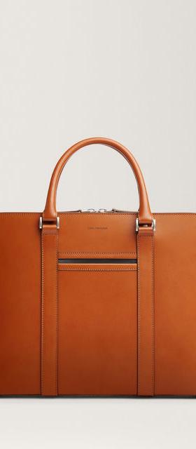 A close-up of a Carl Friedrik bag in tan