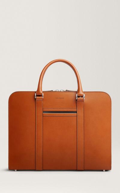 A close-up of a Carl Friedrik bag in tan
