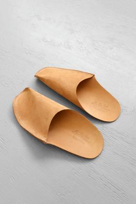 A close-up of a pair of CP Leather Slippers