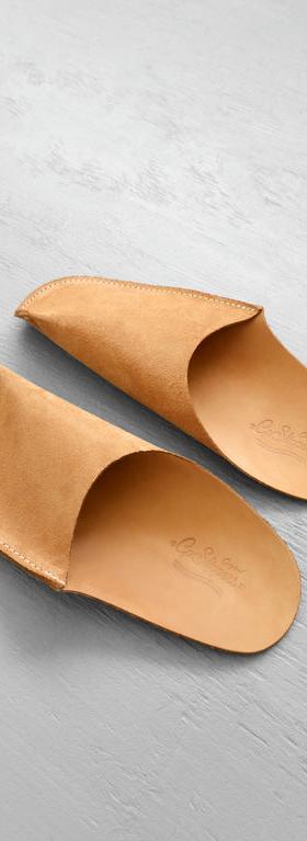 A close-up of a pair of CP Leather Slippers