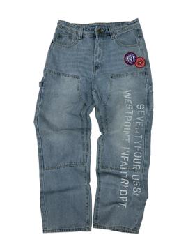 A pair of stonewashed 74isWar carpenter jeans with military patches and stenciled lettering