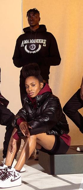 A group wearing A Ma Maniére hoodies, leather jackets and sneakers