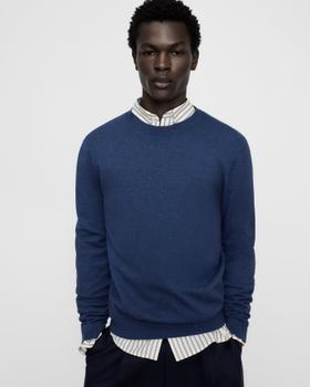 A man wearing a navy Adolfo Domínguez wool-and-cotton crew-neck sweater over a striped shirt