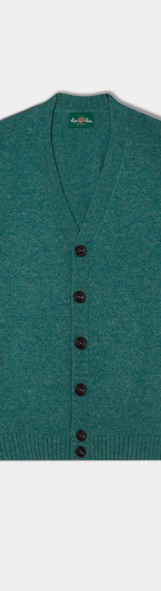 A teal green Alan Paine lambswool cardigan with V-neck and horn buttons on a plain background