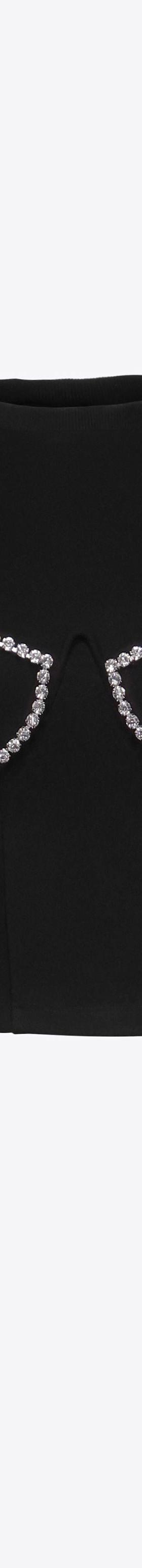 A black AREA crop top with crystal-embellished bra-cup detailing