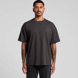 A man wearing a plain black AS Colour heavyweight crew-neck T-shirt with black jeans