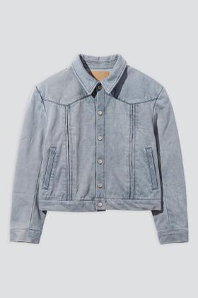 A pale blue washed denim trucker jacket on a plain grey background