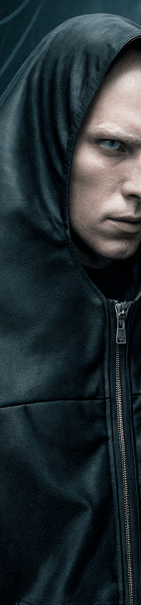 A man wearing a black oversized hooded BatNorton jacket