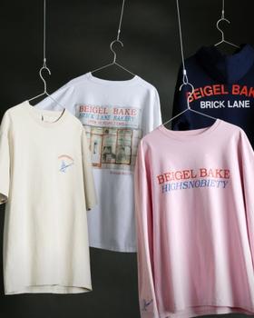 Beigel Bake x Highsnobiety tees, a long-sleeve and a Brick Lane hoodie hanging on wire hangers