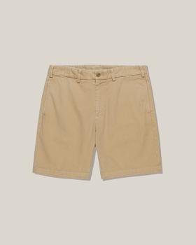 A pair of khaki Bills Khakis cotton twill shorts on a plain background