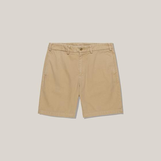 A pair of khaki Bills Khakis cotton twill shorts on a plain background