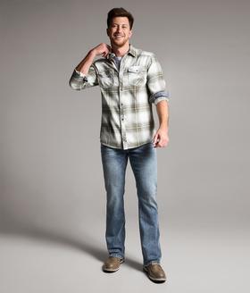 A man wearing a BKE plaid western shirt with light wash bootcut jeans