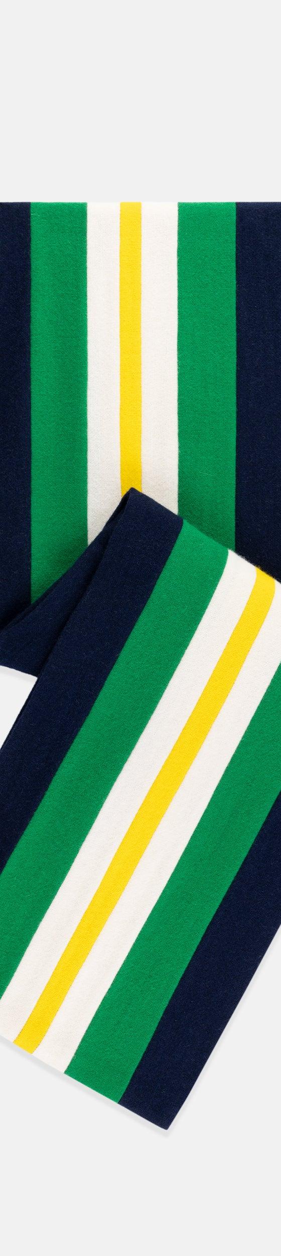 A navy, green, white and yellow striped C.H. Munday club scarf folded on a plain background