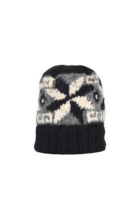 A black, grey and cream hand-knit Chamula beanie with a geometric star motif