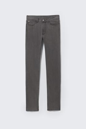 Grey Cheap Monday skinny jeans laid flat