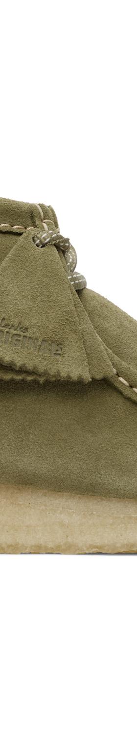 An olive suede Clarks Originals Wallabee boot with a crepe sole