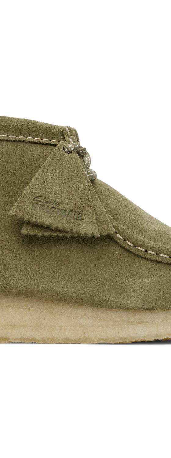 An olive suede Clarks Originals Wallabee boot with a crepe sole