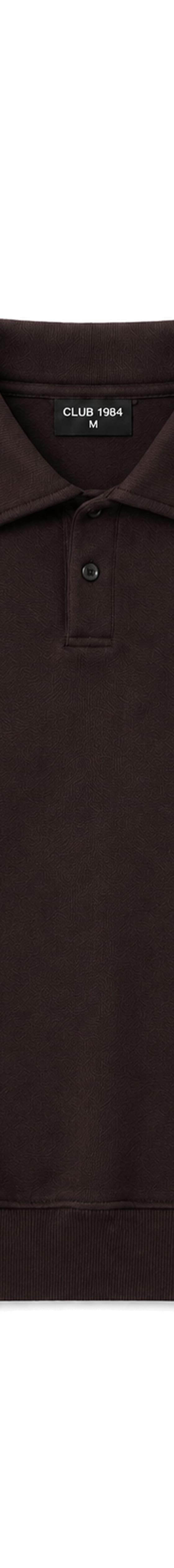 A washed brown Club 1984 collared sweatshirt with embroidered crest on a plain background