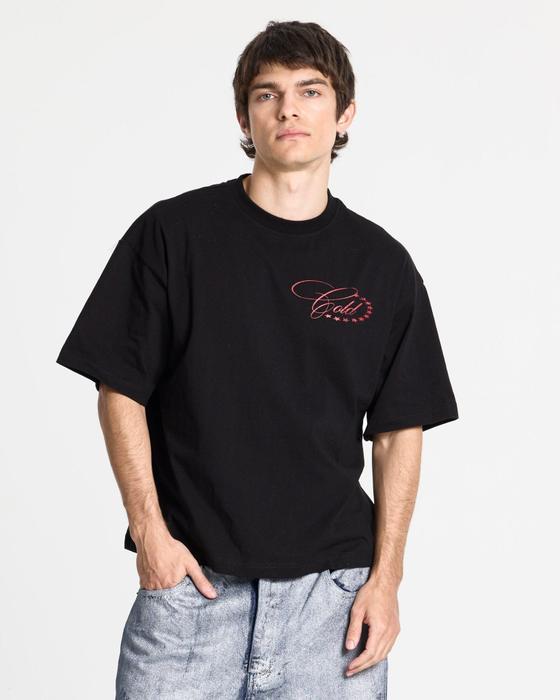 A man wearing a black Cold Culture Worldwide Stars T-shirt