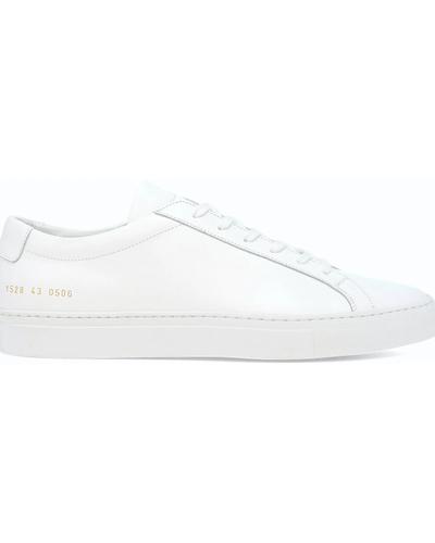 A white leather Common Projects Achilles Low sneaker in side profile