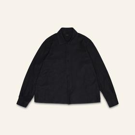 A black linen-cotton Conkers overshirt photographed flat on a cream background