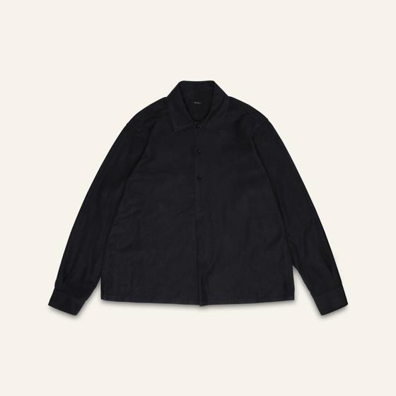 A black linen-cotton Conkers overshirt photographed flat on a cream background