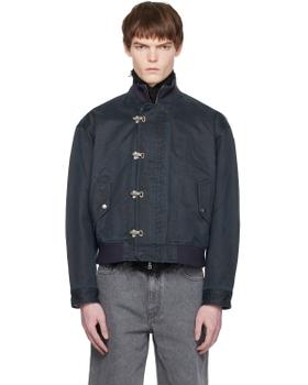 A man wearing a navy COOR blouson jacket with grey jeans