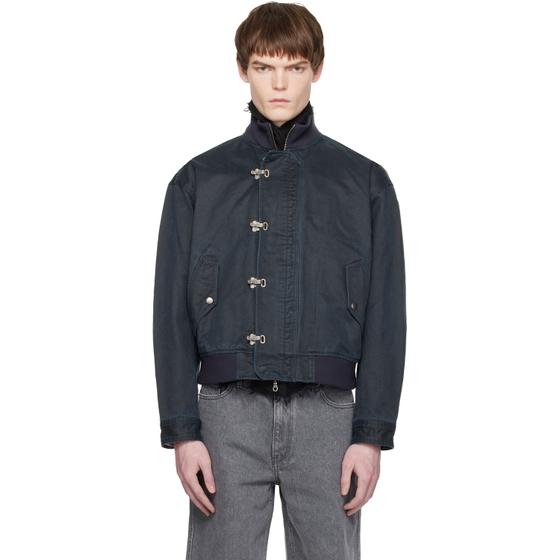 A man wearing a navy COOR blouson jacket with grey jeans