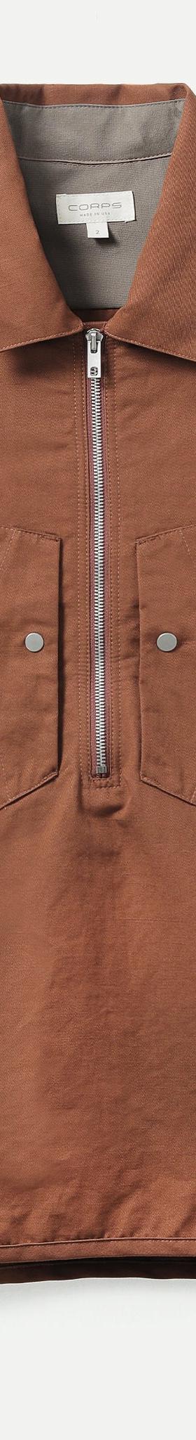 A brown Corpsware half-zip short sleeve utility shirt with patch pockets
