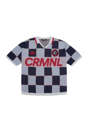 A navy and light blue checkerboard Criminal Damage knitted football shirt on a plain white background