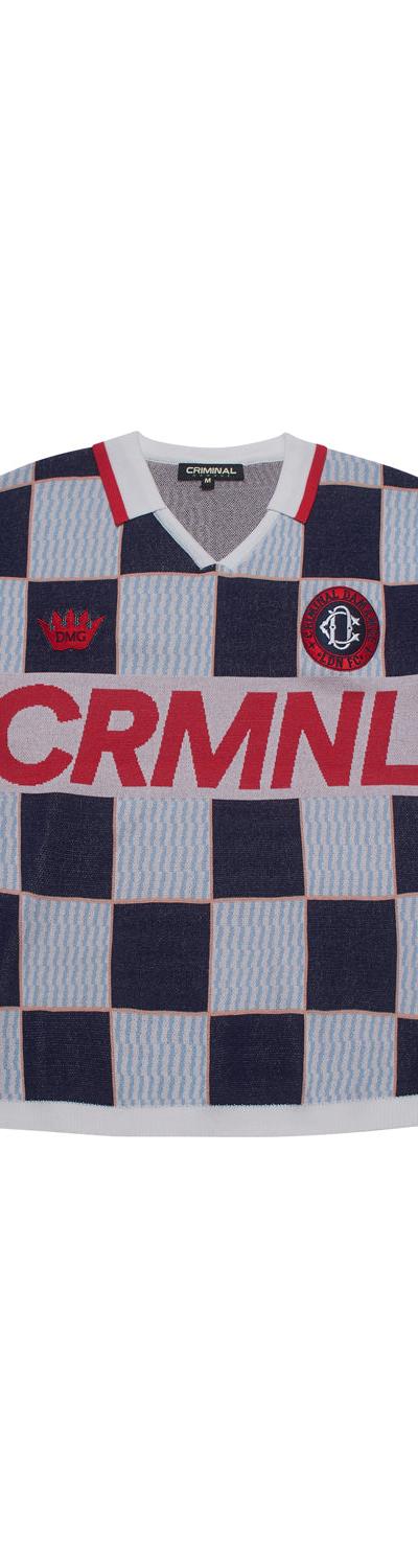 A navy and light blue checkerboard Criminal Damage knitted football shirt on a plain white background