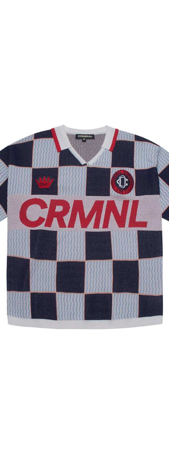 A navy and light blue checkerboard Criminal Damage knitted football shirt on a plain white background