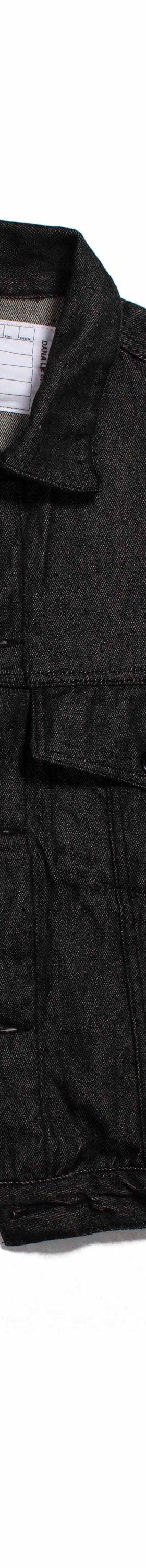 A black naturally dyed Dana Lee denim jacket on a plain white background