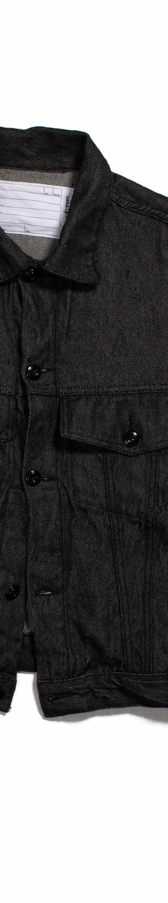 A black naturally dyed Dana Lee denim jacket on a plain white background