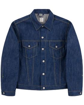 A raw indigo selvedge denim trucker jacket on a plain white background