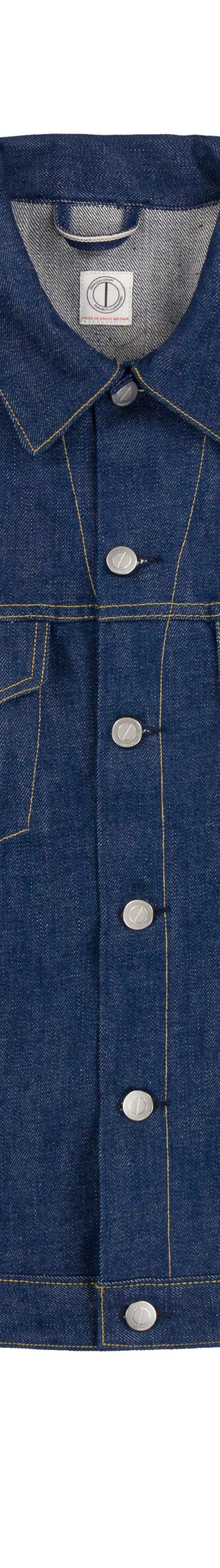 A raw indigo selvedge denim trucker jacket on a plain white background