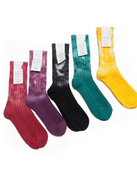 Five pairs of decka Quality Socks in tie-dyed red, purple, black, teal and yellow ribbed cotton on a white background