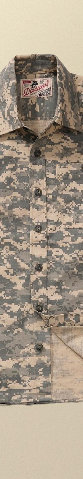 A Devium USA digital camo cotton work shirt on a plain tan background