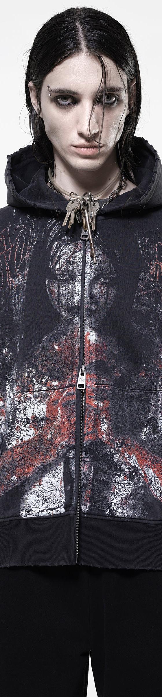 A model wearing an oversized black zip-up hoodie with a distressed horror print by Drop Dead Clothing