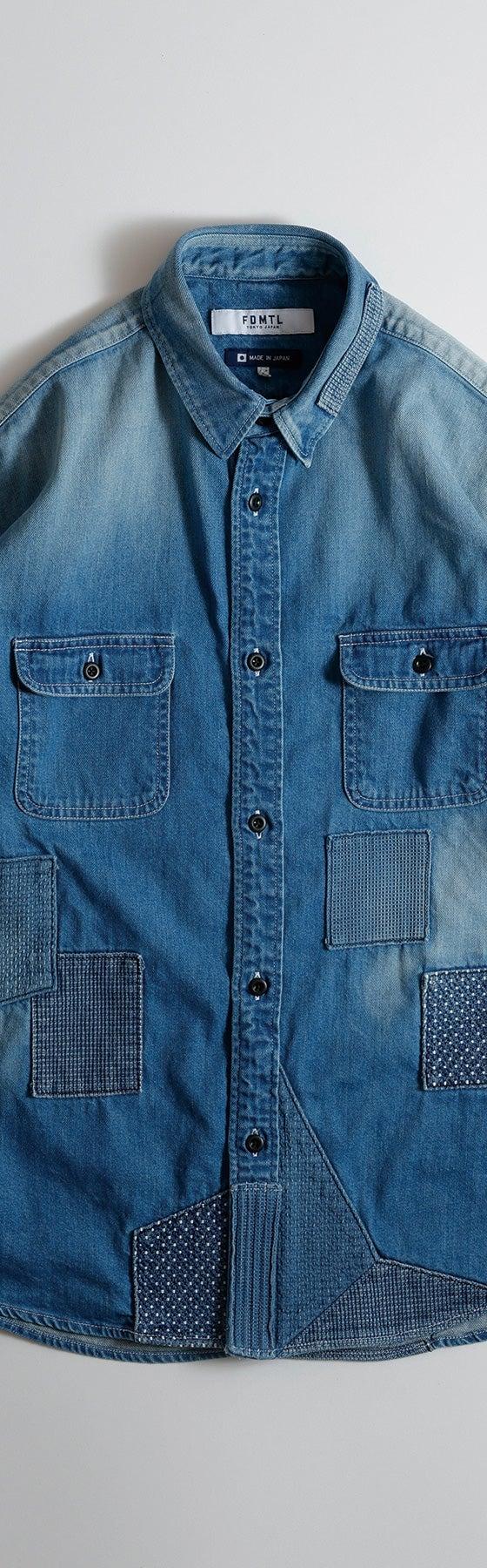 An FDMTL indigo denim shirt with sashiko-stitched boro patchwork