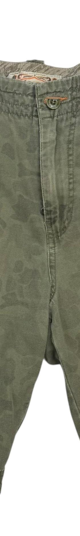 A pair of vintage olive camo cargo shorts on a plain white background