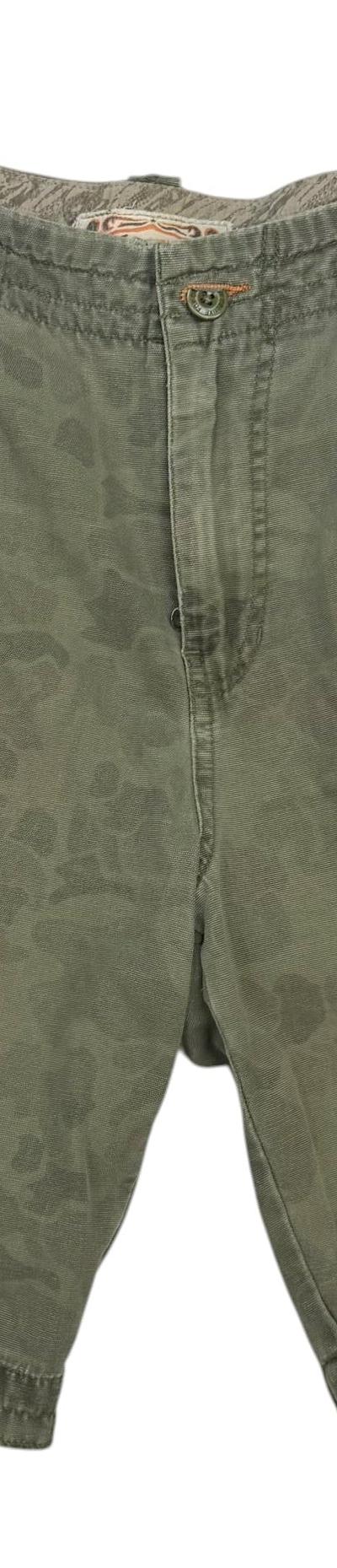 A pair of vintage olive camo cargo shorts on a plain white background