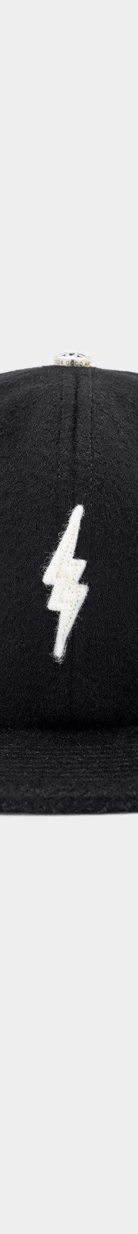 A black wool GOOD ART HLYWD cap with a white lightning bolt embroidery