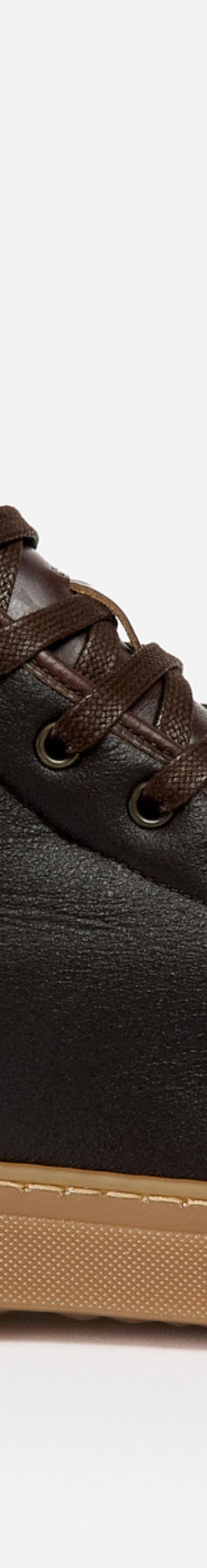 A brown leather Goral high-top sneaker boot with a gum sole on a plain background