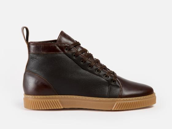 A brown leather Goral high-top sneaker boot with a gum sole on a plain background