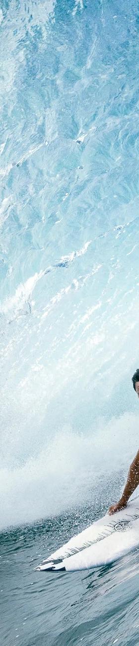 Hawaiian Island Creations surfer riding inside a barrelling wave
