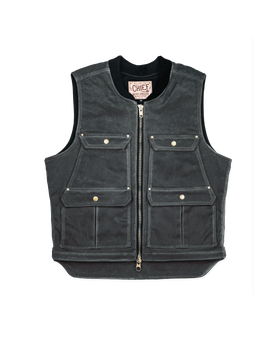 A charcoal waxed canvas utility vest with brass zip and flap pockets