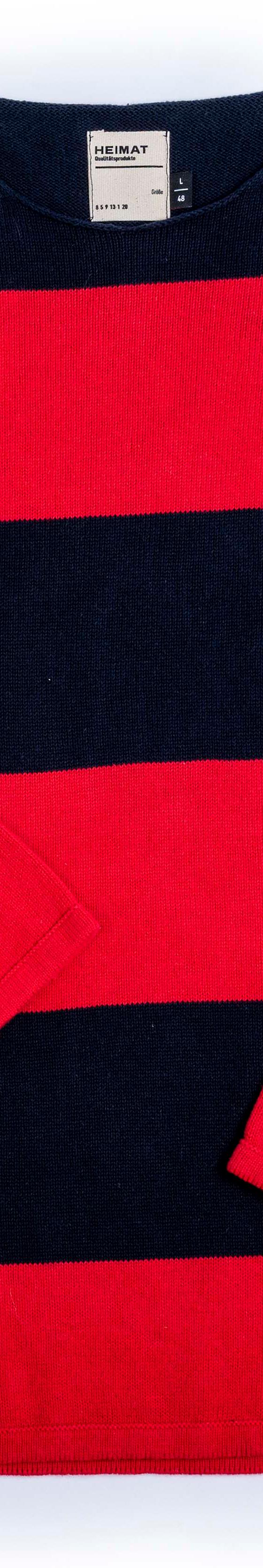 A navy and red block-striped Heimat virgin-wool crewneck sweater laid flat on a white background